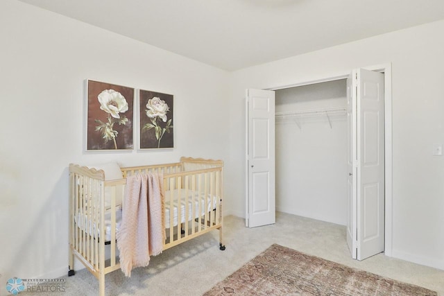 unfurnished bedroom featuring baseboards, a closet, and carpet floors