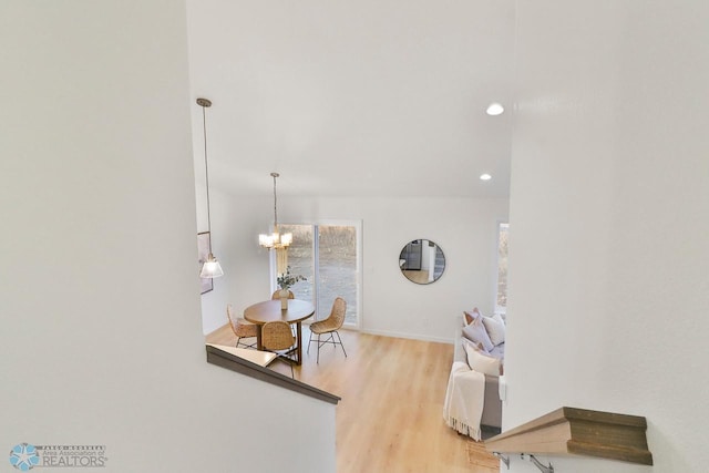 room details with recessed lighting, baseboards, a notable chandelier, and wood finished floors