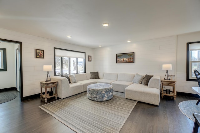 1109 Saint Croix Hts, Hudson, WI 54016 - living area with dark wood-style floors, recessed lighting, wood walls, and baseboards