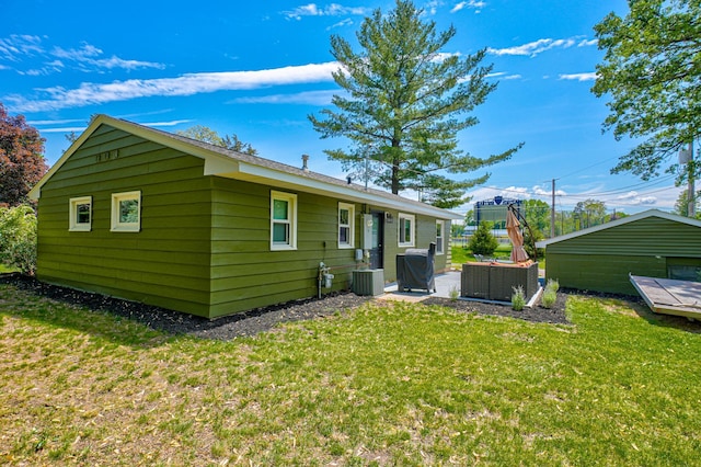 1109 Saint Croix Hts, Hudson, WI 54016 - rear view of property featuring a yard, central AC unit, and a patio