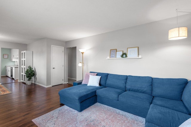 living area featuring wood finished floors and baseboards