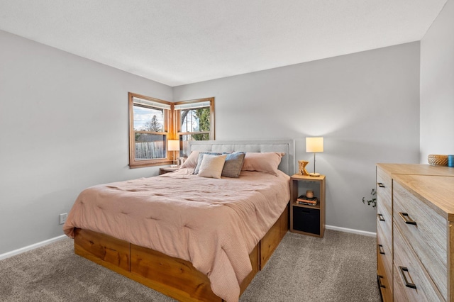 bedroom featuring baseboards and carpet floors