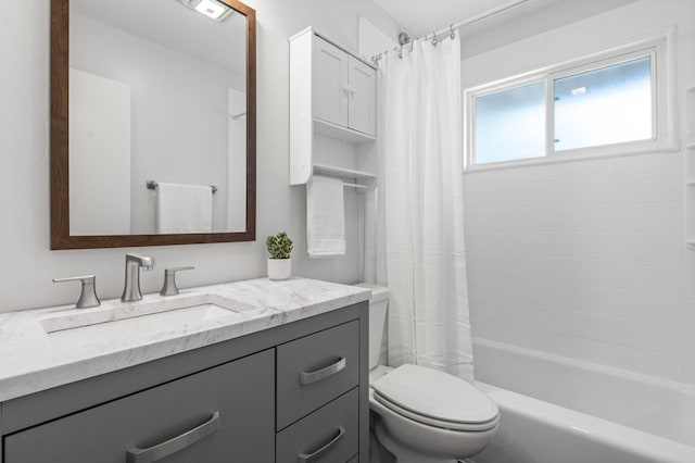 bathroom with shower / bath combination with curtain, toilet, and vanity