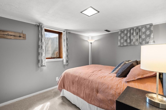 carpeted bedroom featuring baseboards and visible vents