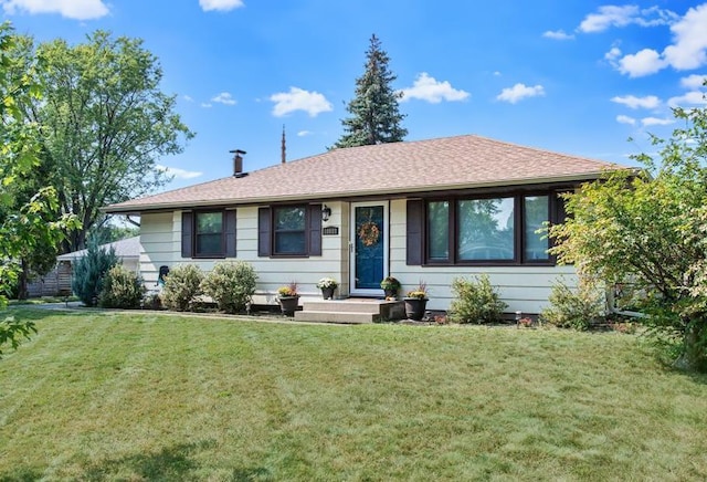 ranch-style house with a front yard and a shingled roof