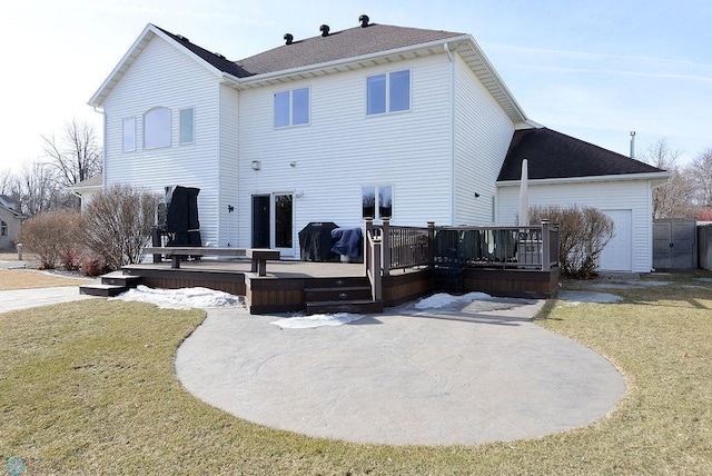 back of property featuring a patio area, a lawn, and a wooden deck