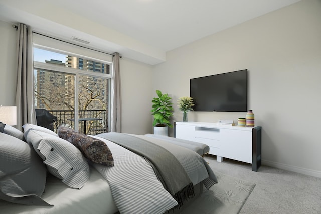 bedroom with baseboards, carpet floors, and access to exterior