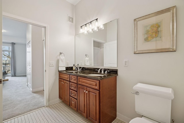 full bathroom featuring a sink, visible vents, toilet, and double vanity