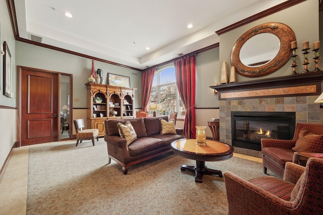 sitting room with recessed lighting, a tray ceiling, visible vents, and a tile fireplace