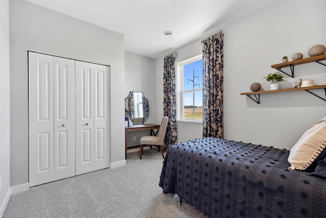 bedroom featuring a closet, carpet floors, and baseboards