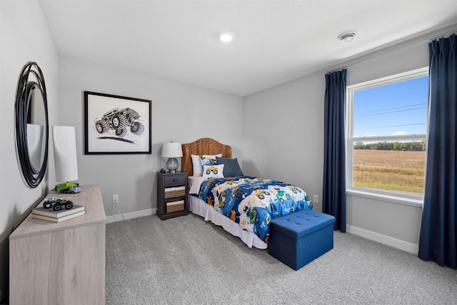 bedroom featuring baseboards and carpet floors