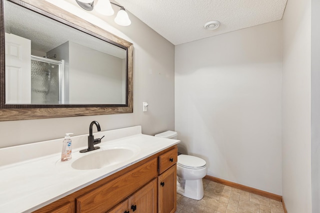 2316 Coldwater Xing, Mayer, MN 55360 - bathroom featuring a shower stall, toilet, a textured ceiling, vanity, and baseboards