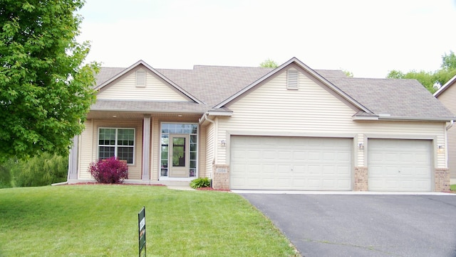 2316 Coldwater Xing, Mayer, MN 55360 - view of front of home with asphalt driveway, a garage, a front lawn, and brick siding