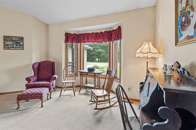 living area with carpet flooring and baseboards