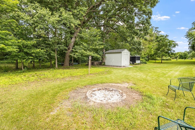 view of yard with an outdoor structure and a shed