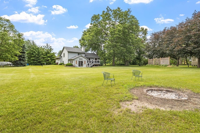 view of yard with a fire pit