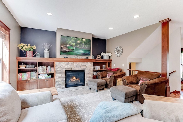 living room featuring a fireplace and recessed lighting