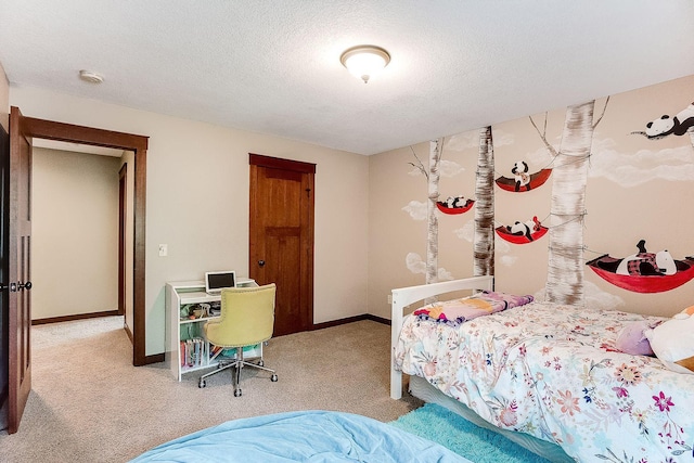 bedroom featuring baseboards, carpet floors, and a textured ceiling