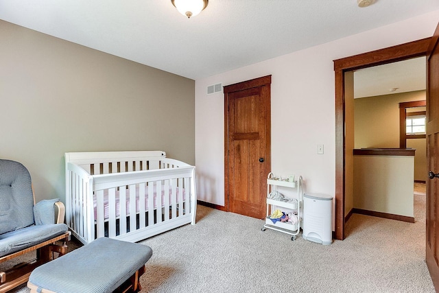 bedroom with carpet flooring, baseboards, and visible vents