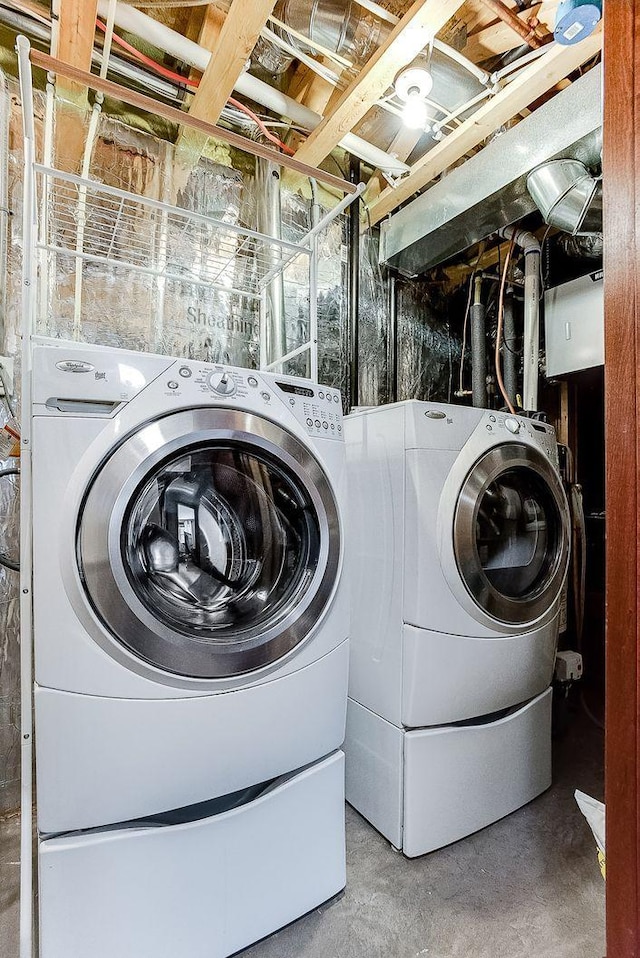 washroom with washer and clothes dryer and laundry area