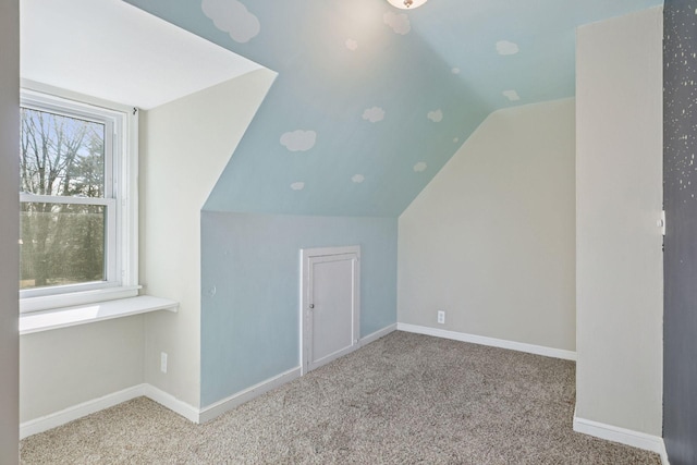 bonus room featuring carpet flooring, lofted ceiling, and baseboards