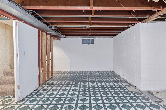 unfinished below grade area featuring tile patterned floors