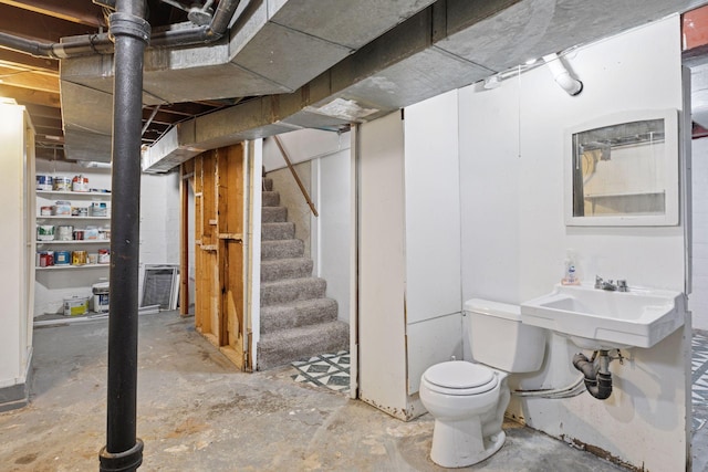 unfinished below grade area with stairs and a sink