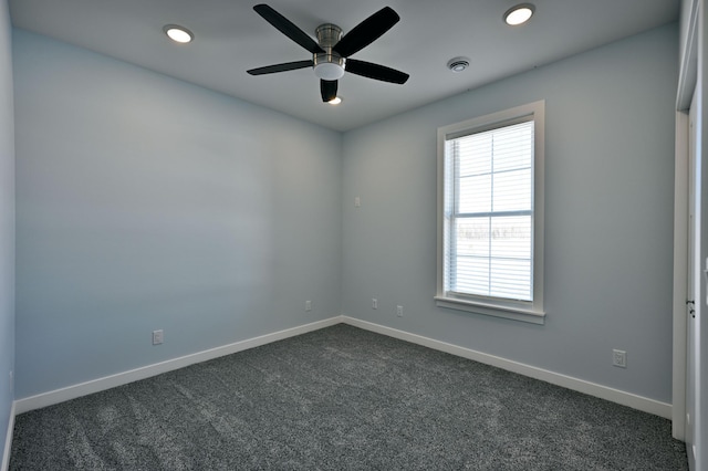 empty room featuring a ceiling fan, recessed lighting, baseboards, and dark colored carpet