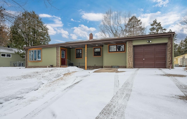 view of front of house with an attached garage and a chimney