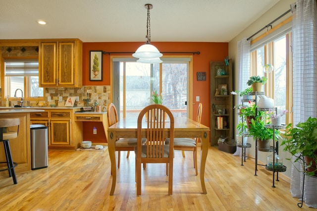 dining area featuring recessed lighting and light wood-type flooring