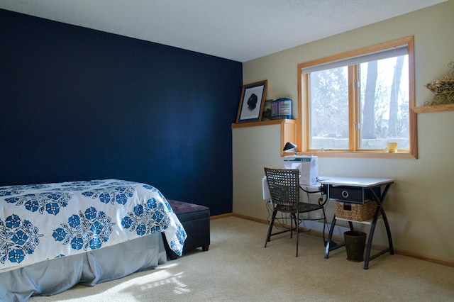 carpeted bedroom with baseboards