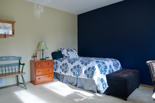 bedroom with carpet flooring and baseboards