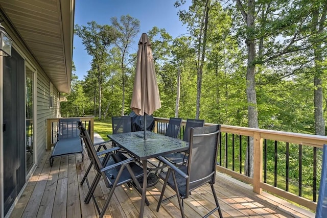 wooden terrace with outdoor dining area