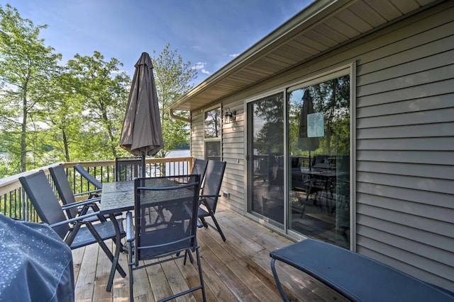 wooden deck with outdoor dining space