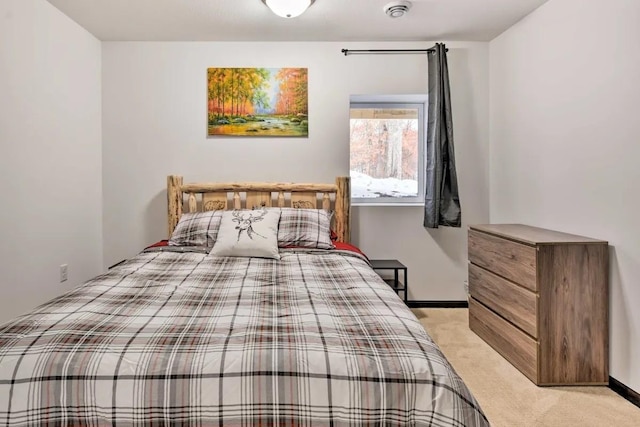 bedroom featuring light colored carpet