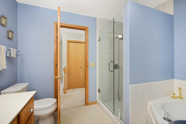 full bathroom featuring a bath, a stall shower, toilet, and vanity