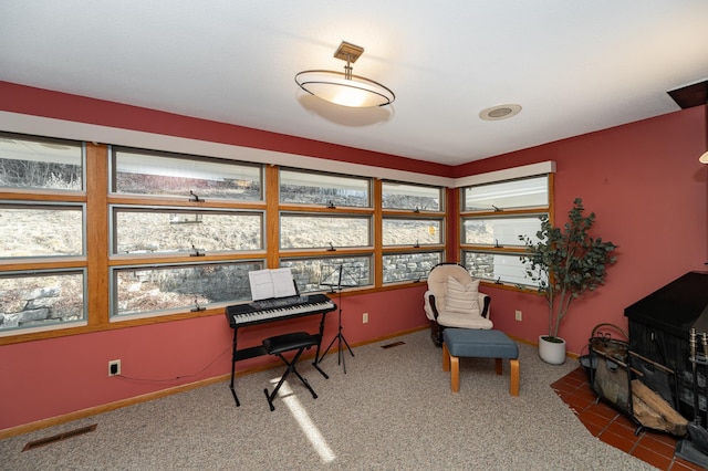 home office with visible vents, baseboards, and carpet flooring