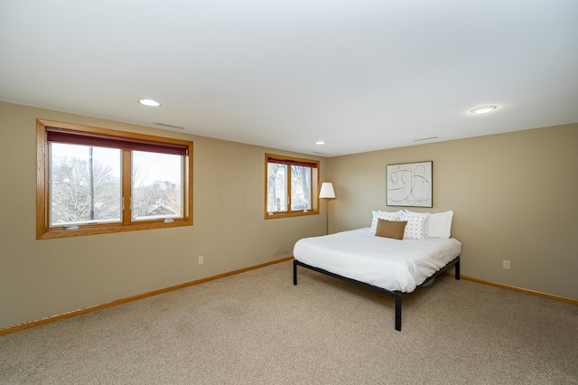 carpeted bedroom with recessed lighting and baseboards