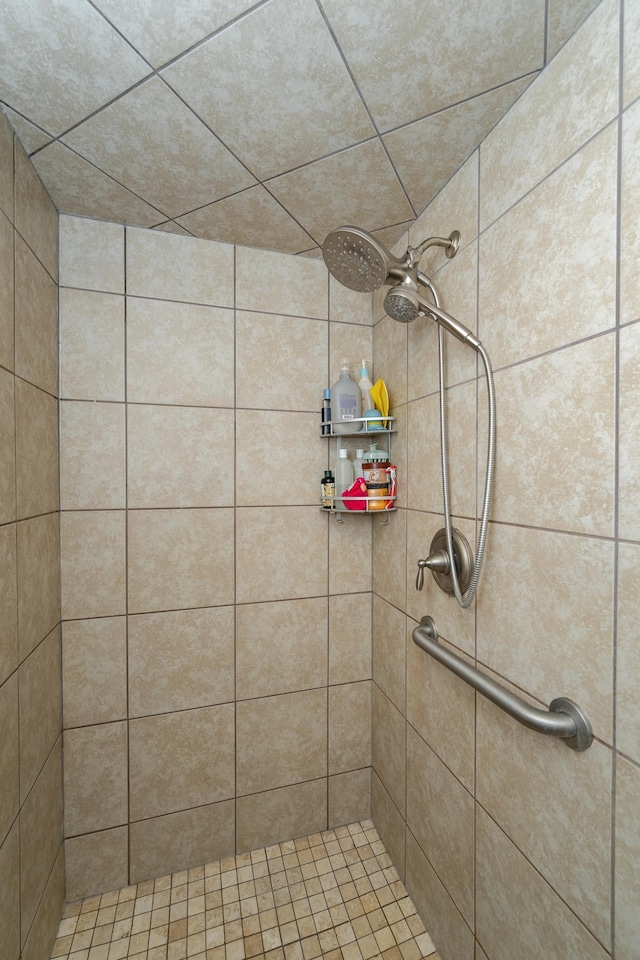 full bath featuring tiled shower