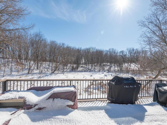 snow covered deck with grilling area