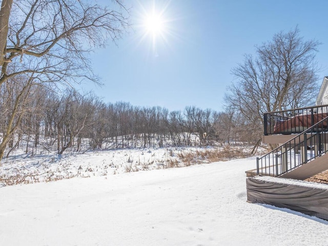 yard covered in snow with stairway