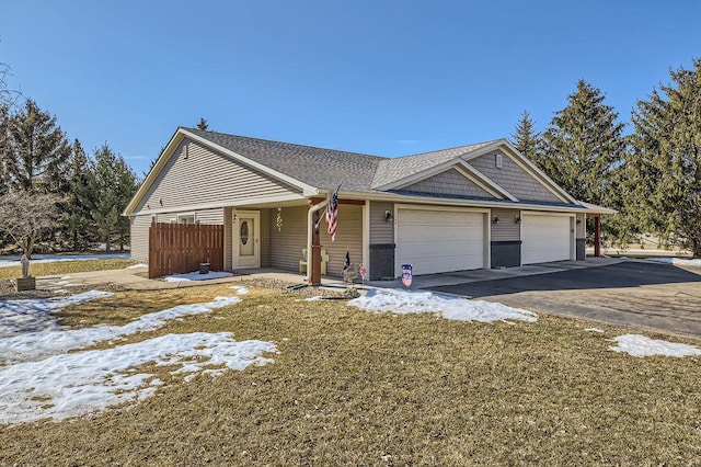 view of front of home with a garage and driveway