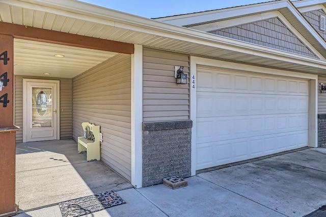 view of exterior entry with driveway