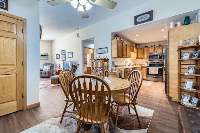 dining space with recessed lighting, a ceiling fan, and light wood finished floors