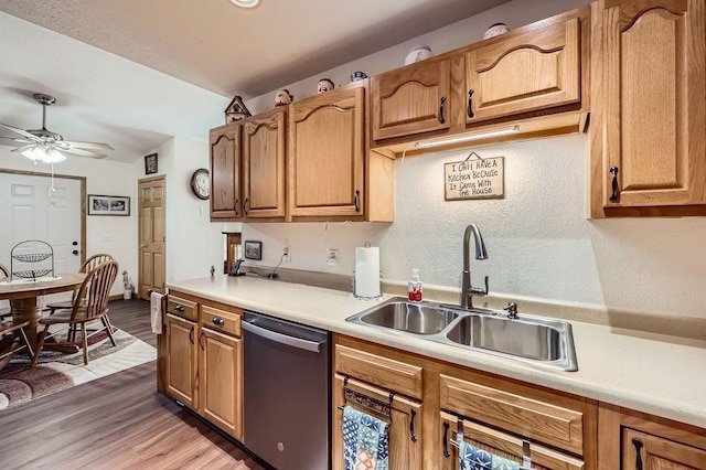 kitchen with light wood finished floors, ceiling fan, dishwasher, light countertops, and a sink