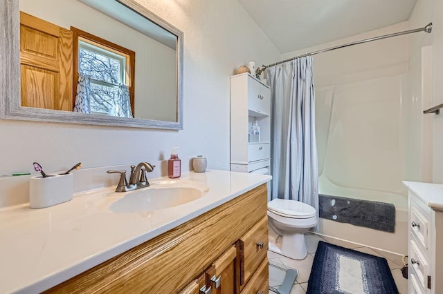bathroom featuring tile patterned floors, toilet, shower / bath combo, and vanity