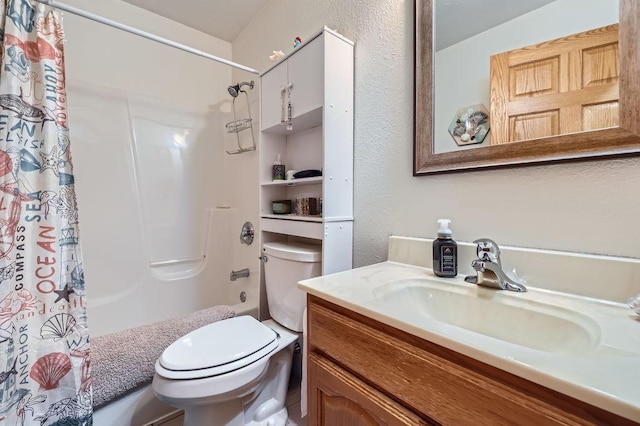 full bathroom with shower / bath combination with curtain, toilet, vanity, and a textured wall