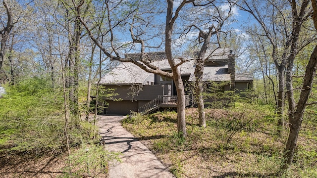 6 Crocus Ln, North Oaks, MN 55127 - view of front of home featuring a garage, stairs, asphalt driveway, and a wooden deck