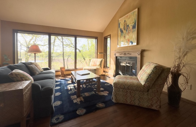 6 Crocus Ln, North Oaks, MN 55127 - living area with hardwood / wood-style floors, a premium fireplace, high vaulted ceiling, and baseboards