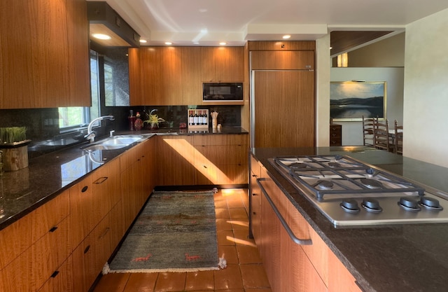 6 Crocus Ln, North Oaks, MN 55127 - kitchen with a sink, black microwave, stainless steel gas cooktop, backsplash, and recessed lighting